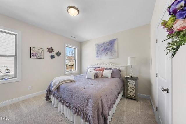 bedroom with light colored carpet