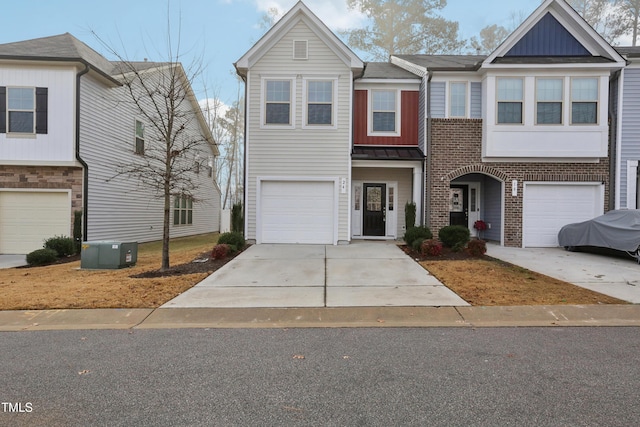 townhome / multi-family property featuring central AC and a garage