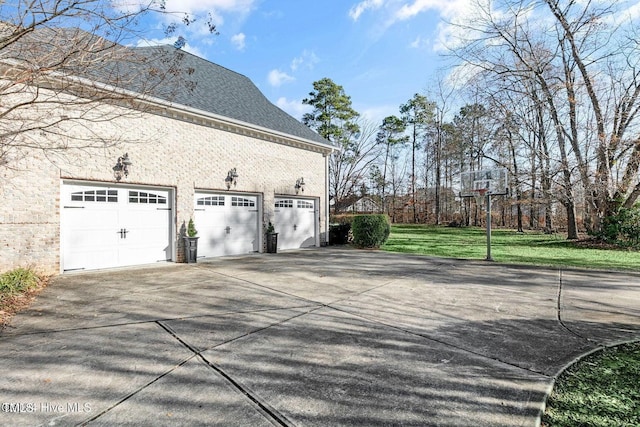 view of home's exterior with a yard and a garage