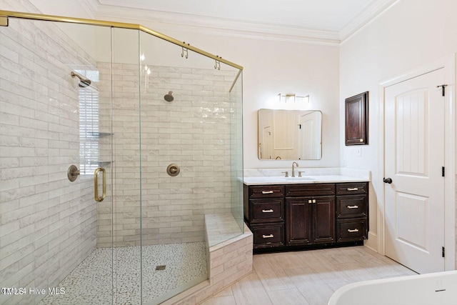 bathroom with vanity, walk in shower, and ornamental molding