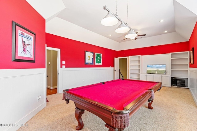 game room with lofted ceiling, built in shelves, pool table, a tray ceiling, and light colored carpet