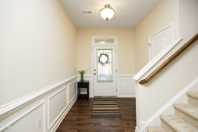 foyer entrance featuring dark wood-type flooring