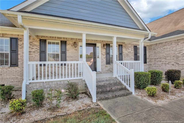 property entrance featuring covered porch