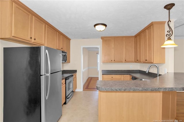 kitchen with pendant lighting, sink, kitchen peninsula, and stainless steel appliances