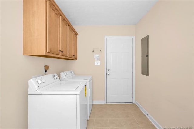 washroom with cabinets, separate washer and dryer, and electric panel