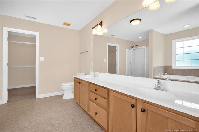 full bathroom featuring tile patterned floors, vanity, independent shower and bath, and toilet