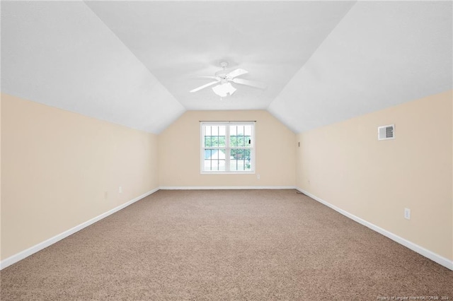 bonus room featuring ceiling fan, carpet, and lofted ceiling