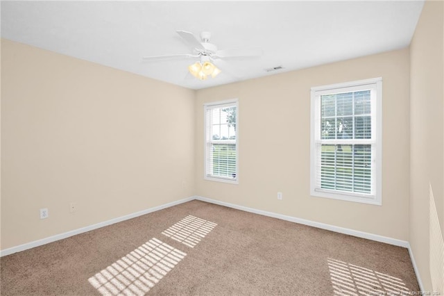 unfurnished room featuring ceiling fan and light colored carpet