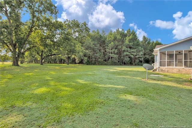 view of yard with a sunroom