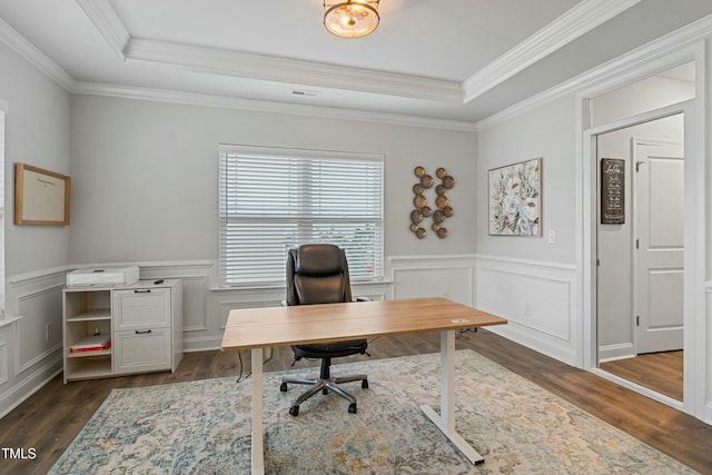 office area featuring a raised ceiling, crown molding, and dark wood-type flooring