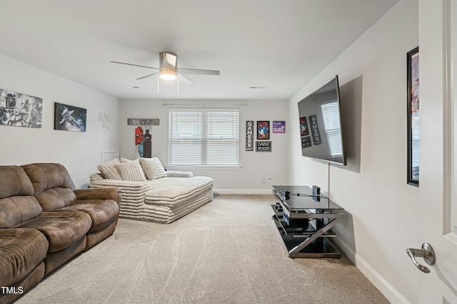 carpeted living room featuring ceiling fan