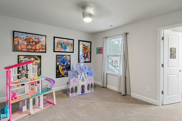 playroom featuring carpet floors and ceiling fan