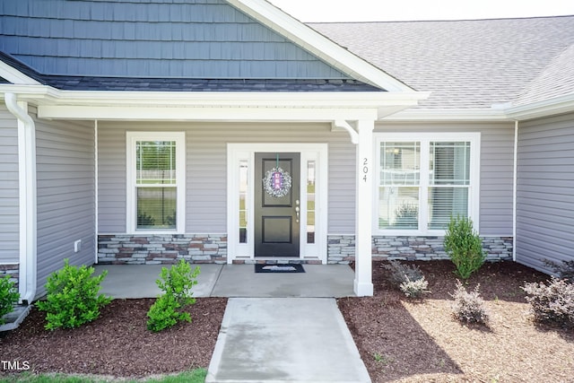 property entrance featuring covered porch