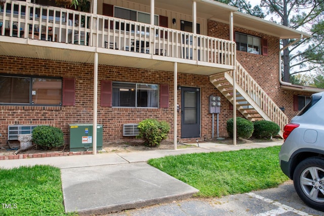 exterior space featuring a balcony and cooling unit