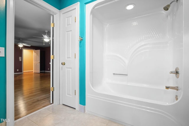 bathroom featuring shower / bath combination, tile patterned floors, and ceiling fan