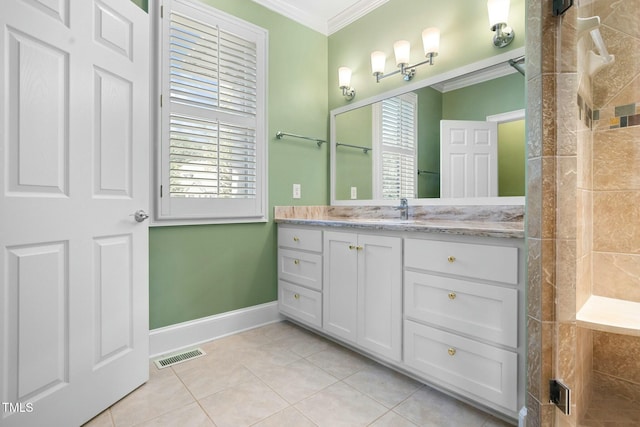 bathroom featuring crown molding, tile patterned flooring, and a healthy amount of sunlight