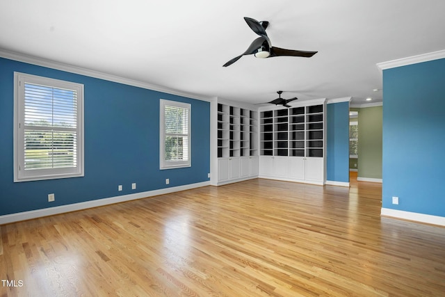 unfurnished room with hardwood / wood-style floors, plenty of natural light, ceiling fan, and ornamental molding