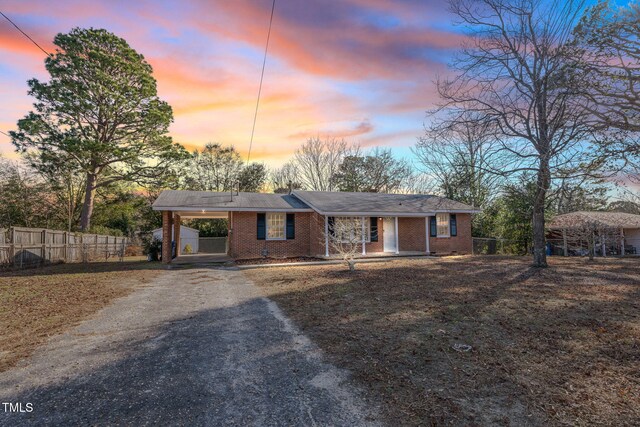 ranch-style home with a yard