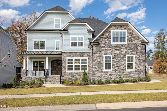 craftsman-style home featuring a front lawn and a porch