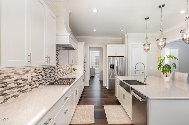 kitchen featuring pendant lighting, sink, light stone counters, white cabinetry, and stainless steel appliances