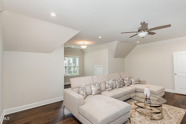 living room with dark hardwood / wood-style floors, ceiling fan, and ornamental molding