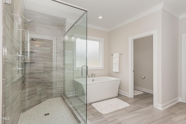 bathroom featuring crown molding and plus walk in shower