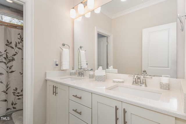 bathroom with vanity and ornamental molding