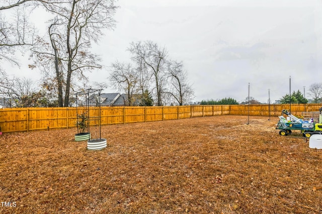 view of yard featuring a fenced backyard