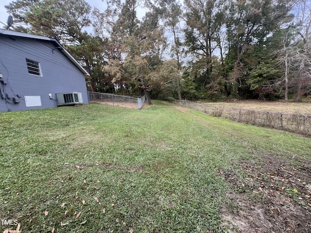 view of yard featuring central AC unit