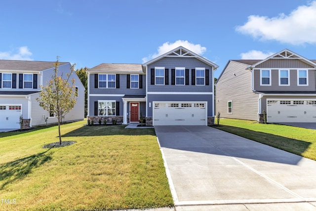 view of front of home with a front yard and a garage