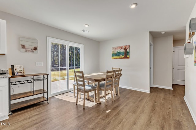 dining area featuring light wood-type flooring