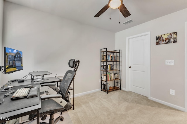 office featuring ceiling fan and light colored carpet