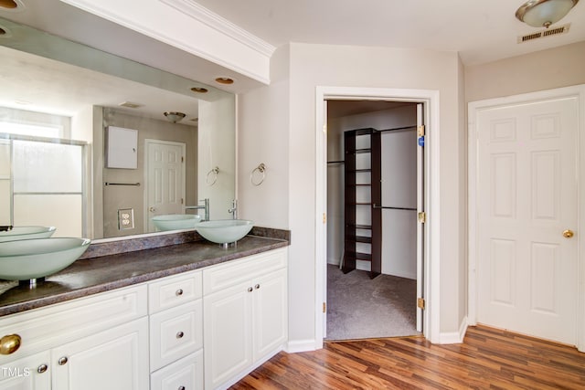 bathroom with vanity and hardwood / wood-style floors