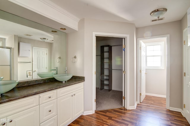 bathroom with vanity and hardwood / wood-style floors