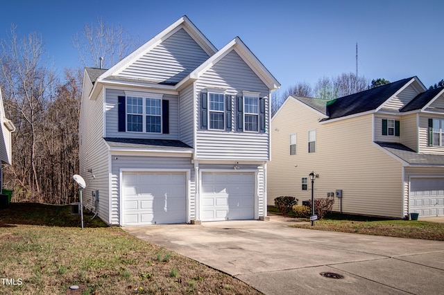 view of front of house featuring a garage and a front lawn