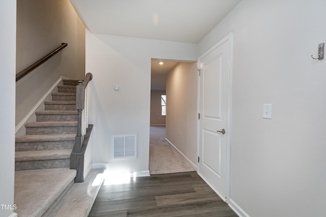 staircase featuring hardwood / wood-style floors