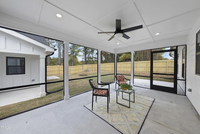 sunroom / solarium featuring ceiling fan and coffered ceiling