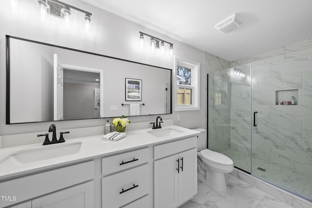 bathroom with vanity, an enclosed shower, and toilet