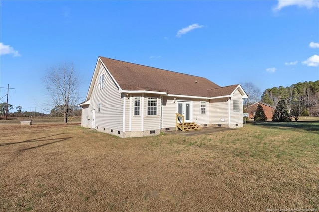 back of house featuring a lawn