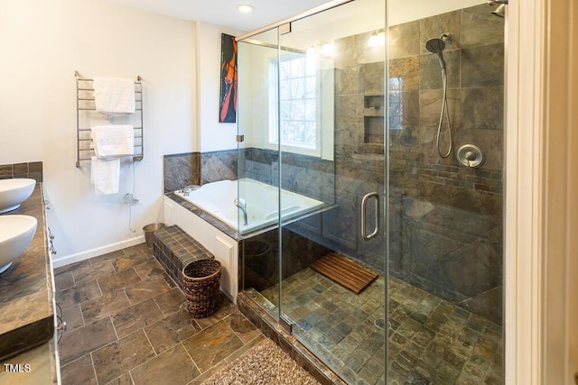 bathroom featuring separate shower and tub, radiator heating unit, and vanity