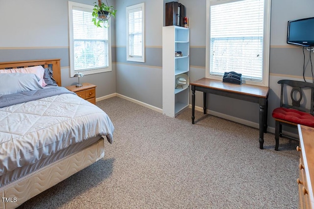 bedroom featuring light colored carpet