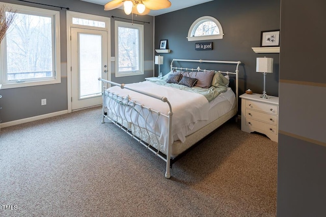 bedroom featuring carpet flooring, multiple windows, and ceiling fan