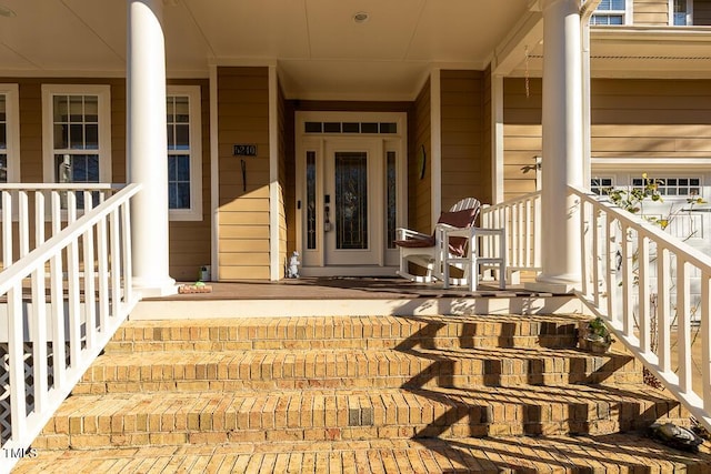 doorway to property featuring a porch