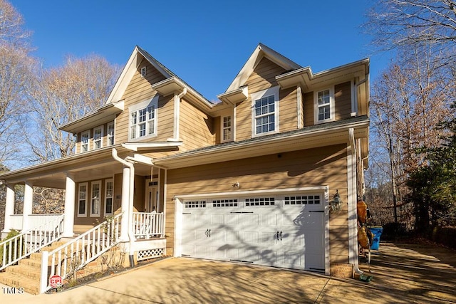 view of front facade with a porch and a garage