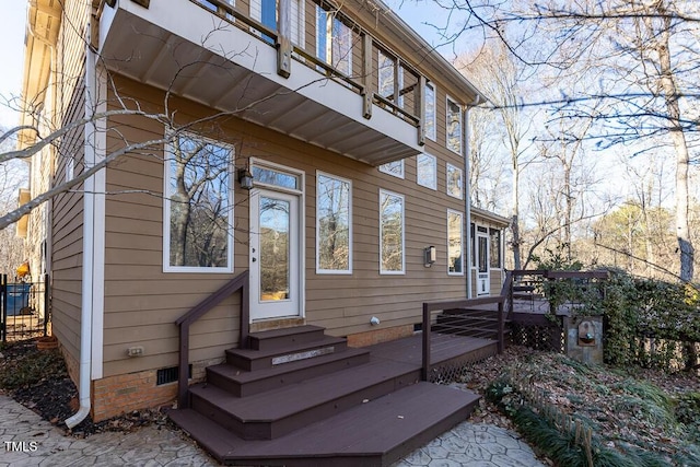 doorway to property with a wooden deck