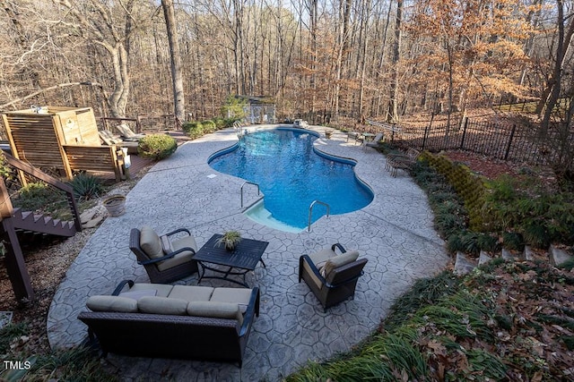 view of pool featuring a patio area