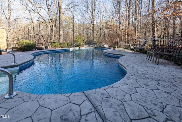 view of swimming pool with a patio