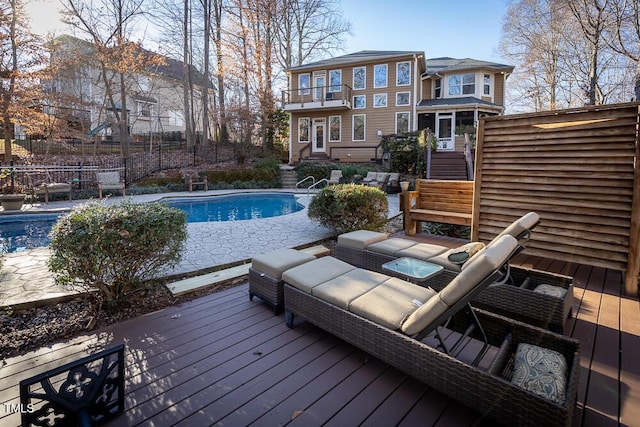 view of swimming pool featuring a wooden deck