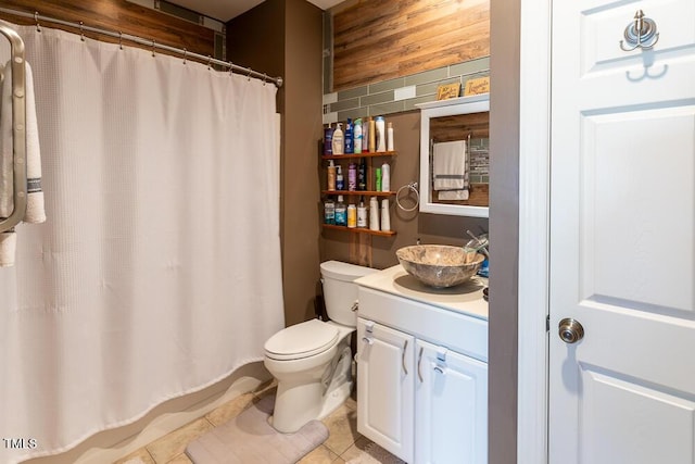 bathroom with tile patterned floors, vanity, and toilet