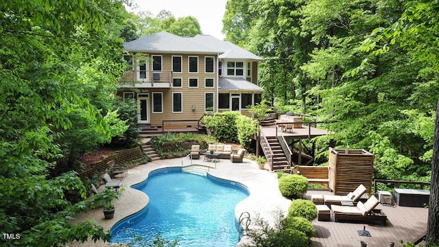 5240 Indigo Moon Way, Raleigh, NC 27613 - back of house featuring an outdoor living space, stairs, a wooden deck, a balcony, and an outdoor pool